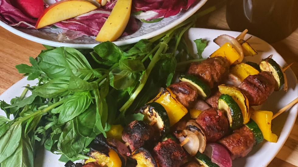 Beef polpette skewers over the fire with a nectarine and radicchio sal – Peter Bouchier
